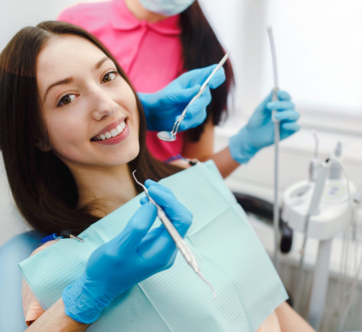 smiling-woman-dentist-chair-scaled.jpg